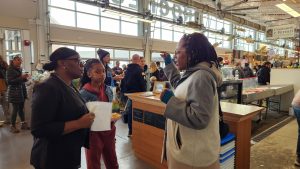 AAWCC members visiting one of the indoor buildings of vendors at the Rochester Public Market.