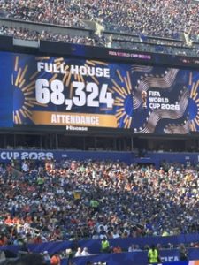 Scoreboard: Scoreboard in Kansas City with the text Full House 68,324.