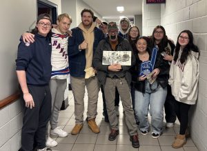 Phi Theta Kappa students take a group photo together at a conference