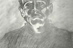 A pencil drawing of Boris Karloff made up as Frankensteins Monster. Lit from below, the hogh contrast drawing accentuates his chin and cheeckbones. Electrical bolts emerge from his neck and the top of his head is flat.