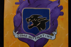 A painting that the majority of the canvas contains a human heart, painted in purple hues. A shield in front of the heart displays a panthers head in silhouette and below that a banner that reads Come Out Fighting.