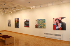 Installation shot of the right gallery wall, which contains five paintings.