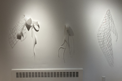 Image showing installation of art in the Mercer Gallery. Abstract forms hanging on the wall of the gallery.