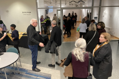 An image showing a group of people enjoying the art in the gallery.