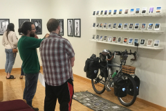 Gallery talk for. Depth Of Field. This image shows Donald Hyatt discussing his work with a student.