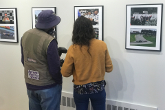 Gallery talk for. Depth Of Field. This image shows Anthony Bristol discussing his work with a journalism. student.