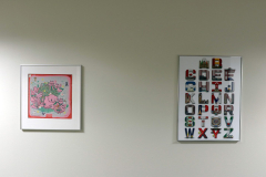 Detail image of artwork hanging in building 12 second floor. This area is known as Farrell Way. Artwork shown by Torrell Arnold and Alex Page.