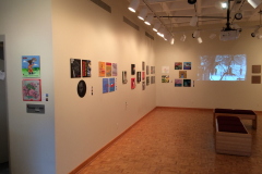 Installation shot of For The Record, including the left wall with 22 images.