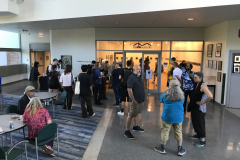 Image from the opening reception of Jenn Libby's exhibition Echoes from the Ether. This image shows a large group of people outside the gallery.