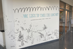 Entrance to the gallery, showing the artists wall painting, highlighting her name and the title of the exhibition.
