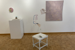 A close up of the two sculptures in the gallery.