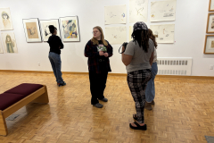 visitors enjoying opening reception for Julianna Furlong Williams Exhibition.