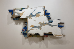 Installation photography of Nate Hodge Exhibition. In the image we see  a close up of a wall sculpture, which is a large piece of wall section that is sculptural.