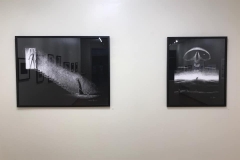 Installation shot of rear gallery wall containing 2 comic illustrations.