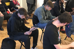 Close up of people looking at materials.