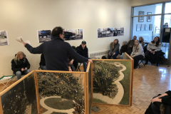 Lecture by Philip Lange, in the gallery amongst his work, with students, faculty and members of the community listening.