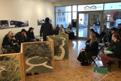 Lecture by Philip Lange, in the gallery amongst his work, with students, faculty and members of the community listening.