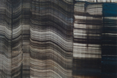 An abstract print of contrasting tones with a horizontal streaking appearing throughout the picture plane.