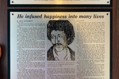 Plaque with an engraved newspaper Article on Tom Mercer.