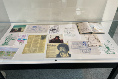 Case with various sketches, drawings, notes and photographs of Tom Mercer.