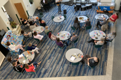 An overhead shot of a group of visitors watching a performance.