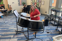 A participant plays the steel drums.