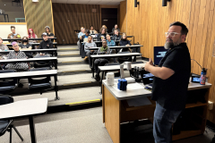 visitors enjoying lecture for WALL\THERAPY Exhibition.