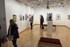 visitors enjoying opening reception for WALL\THERAPY Exhibition.