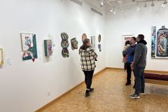 visitors enjoying opening reception for WALL\THERAPY Exhibition.