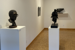 Wayne Williams installation, showing various sculptures along the left wall.