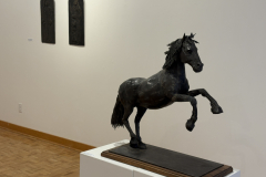 Wayne Williams installation, showing various sculptures along the right wall.